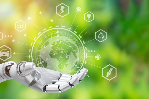 Robot arm holding earth on green tree background,Environment concept, Artificial Intelligence and Technology ecology concept.